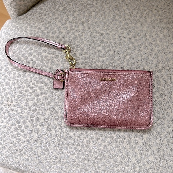 Coach Handbags - Coach pink glitter wristlet excellent condition